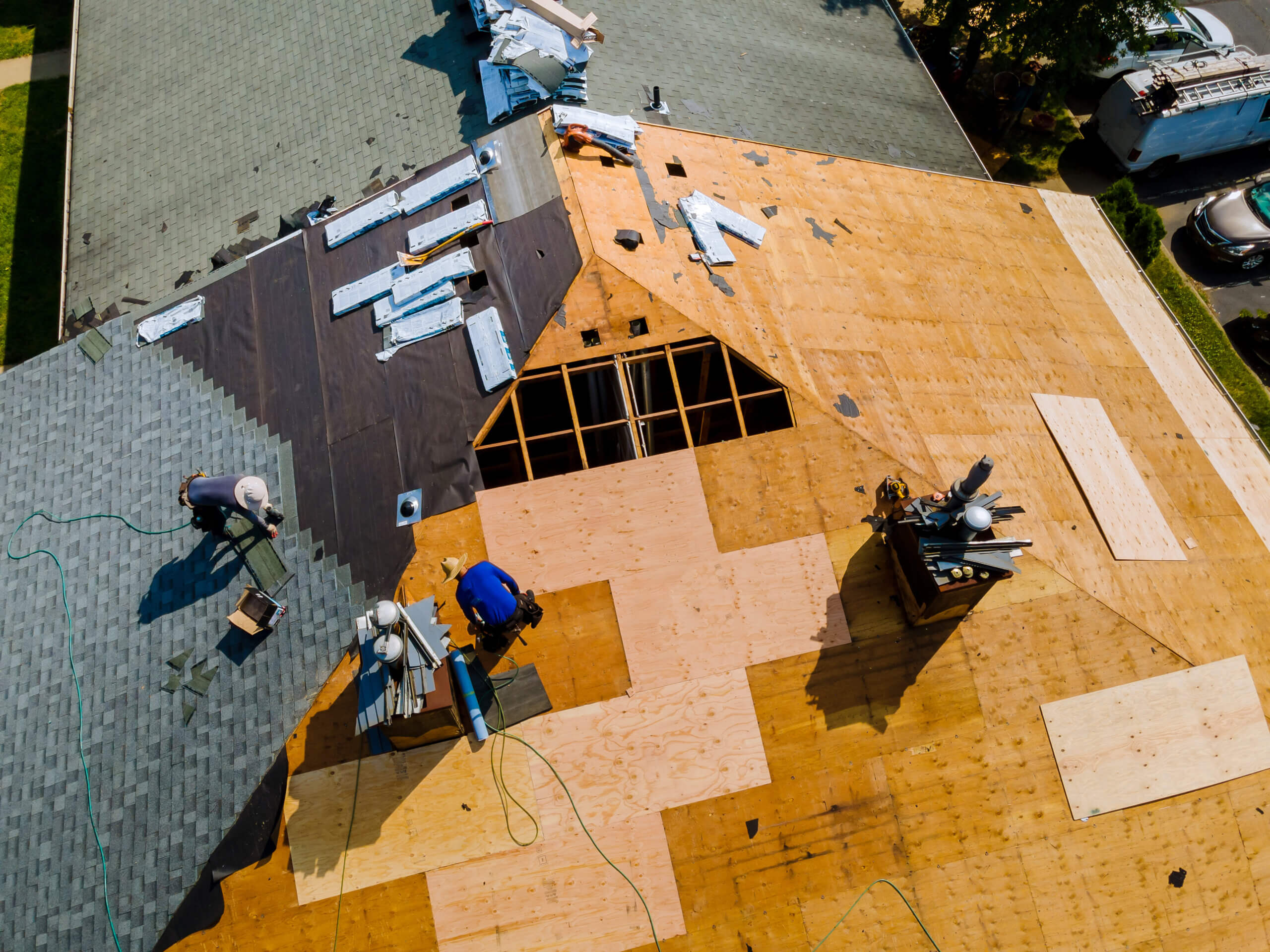 Apartment building roof underwent repairs that included installation of new shingles replacing old roof